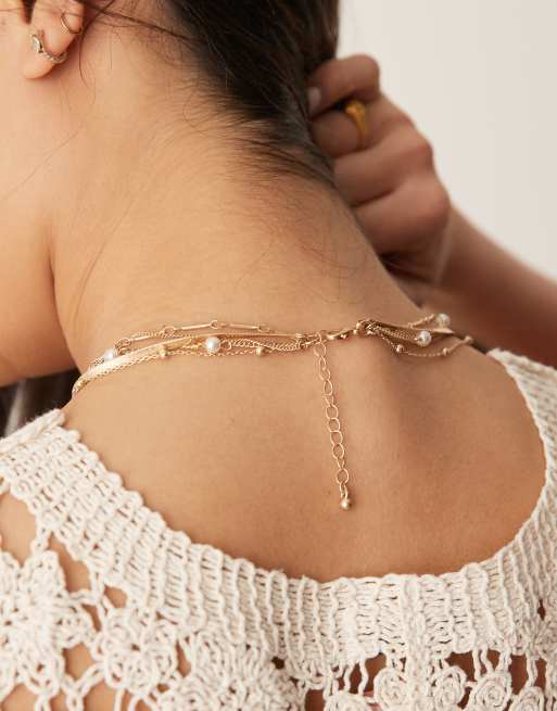 ASOS DESIGN multi-row necklace with pearl and heart detail in brushed gold tone, 2 of 3