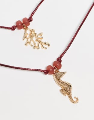 ASOS DESIGN MULTI-ROW RED CORD NECKLACE WITH SEA LIFE CHARMS 