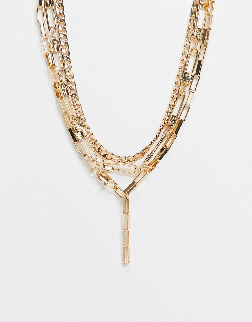 ASOS DESIGN multi-strand necklace with safety pins and lariat in gold tone