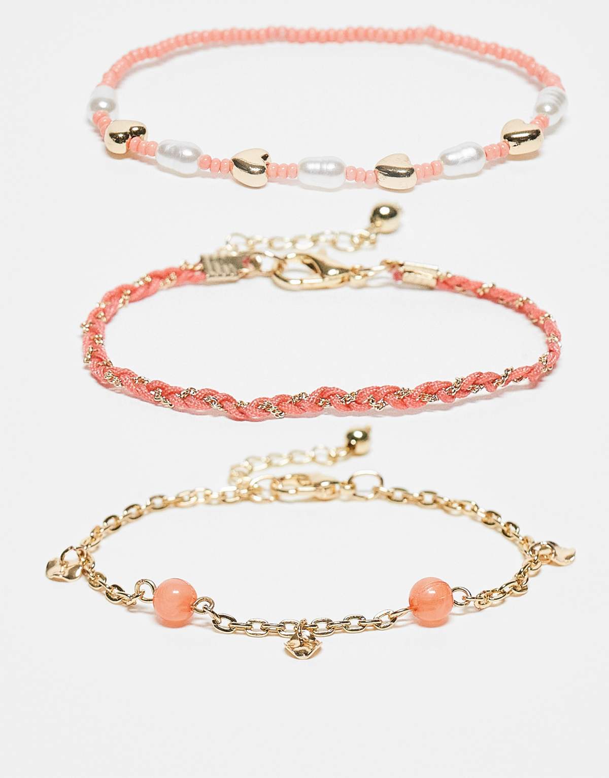 ASOS DESIGN multipack of beaded bracelets in coral and gold tone