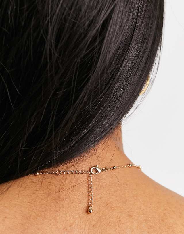 ASOS DESIGN multirow necklace with celestial and vintage pendant in gold tone 0