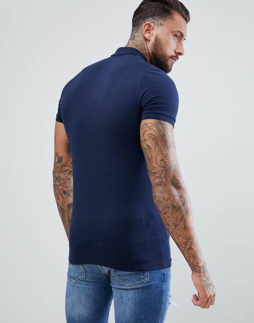 ASOS DESIGN muscle fit jersey polo in navy