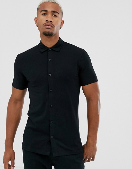 ASOS DESIGN muscle fit jersey shirt in black