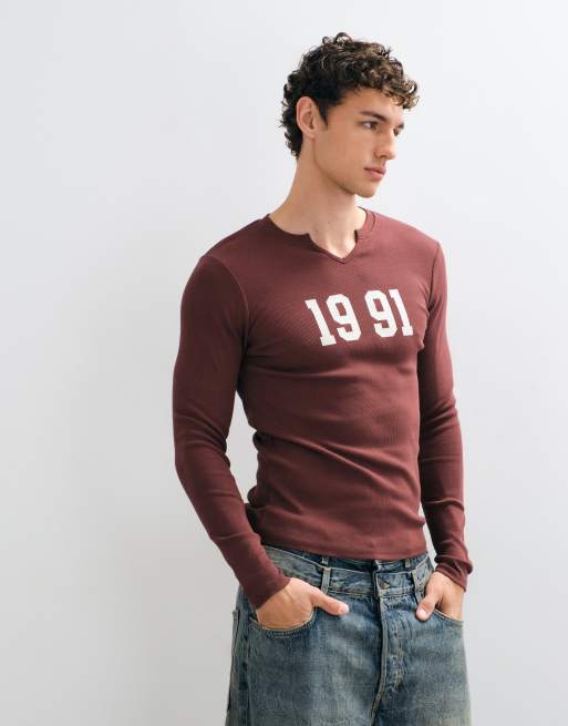 ASOS DESIGN muscle fit notch neck long sleeve top with 1991 varsity print in brown, 2 of 5
