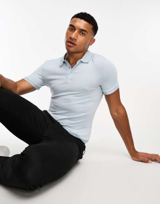 ASOS DESIGN - Muscle fit poloshirt in lichtblauw