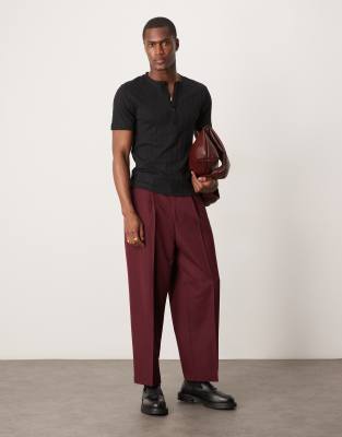 ASOS DESIGN muscle fit ribbed T-shirt with henley neck in black