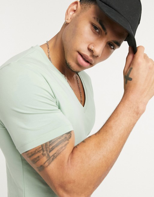 ASOS DESIGN muscle fit t-shirt with deep v neck in green