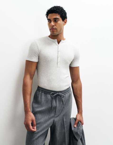 ASOS DESIGN muscle fit t-shirt with henley neck in beige marl rib