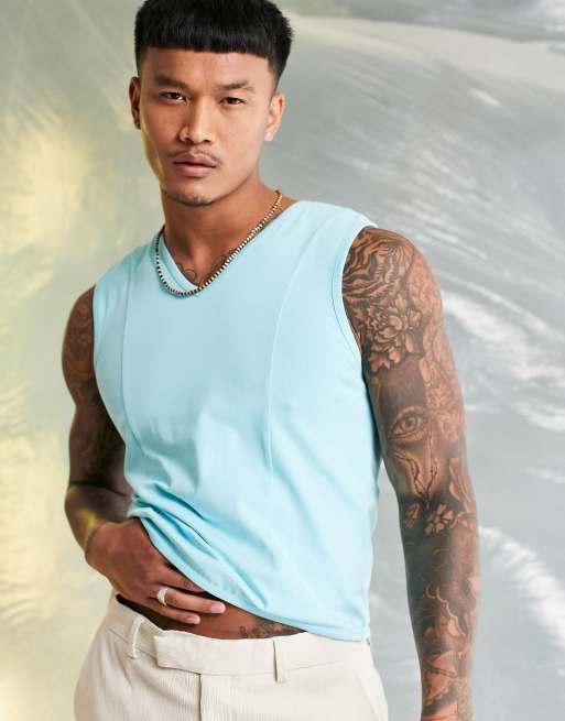 ASOS DESIGN muscle fit tank top with v-neck and seams in blue