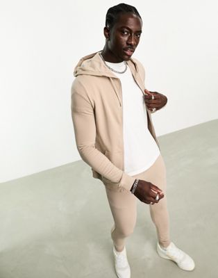 ASOS DESIGN muscle fit zip through hoodie with super skinny joggers tracksuit in beige