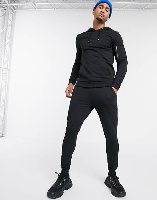 ASOS DESIGN muscle tracksuit with hoodie & MA1 pockets in black | ASOS