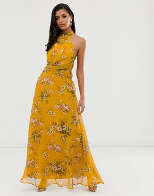 ASOS DESIGN – Musztardowa sukienka maxi we wzór w kwiaty, fason z drapowaną  talią i wysokim dekoltem z wiązaniem na szyi | ASOS