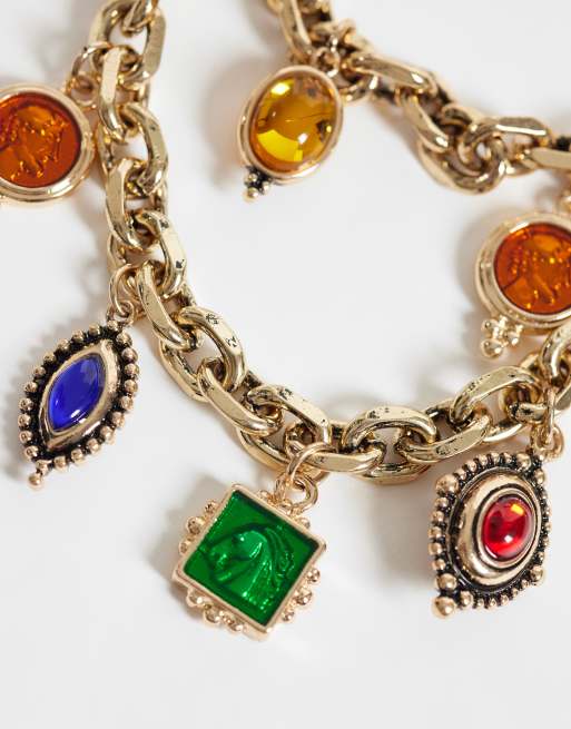 ASOS DESIGN mutli-row chain necklace with charm pendants in antique gold tone, 2 of 3