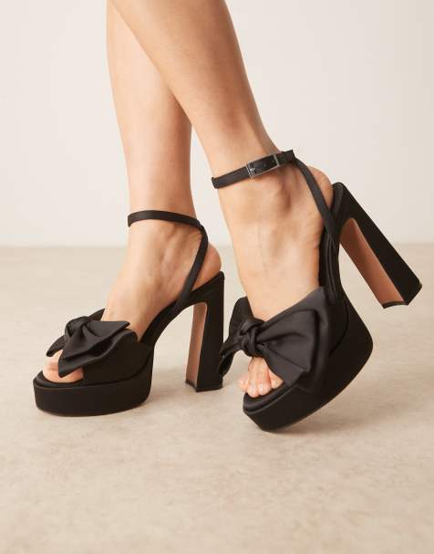 ASOS DESIGN Nala oversized bow platform heel sandals in black satin - view 1