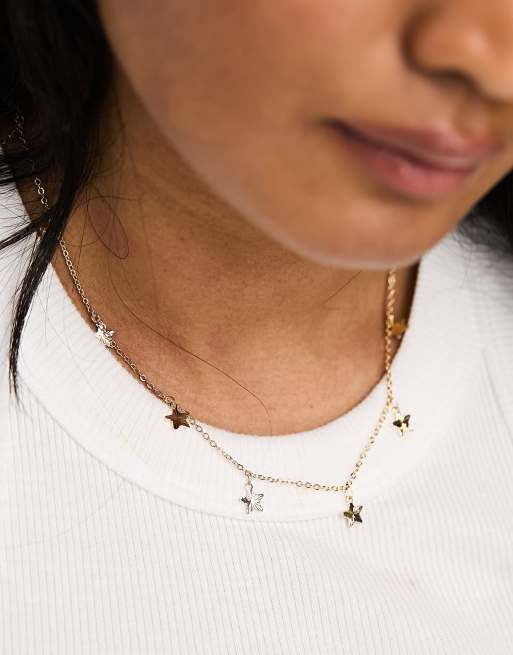 ASOS DESIGN – Naszyjnik średniej długości w kolorze złotym z zawieszkami w kształcie gwiazdek