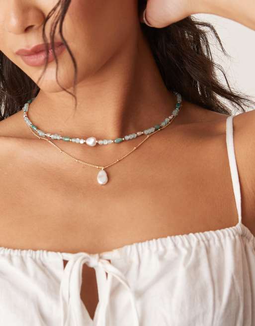 ASOS DESIGN – Naszyjnik wielorzędowy w kolorze złota ze sztucznymi perełkami i niebieskimi koralikami