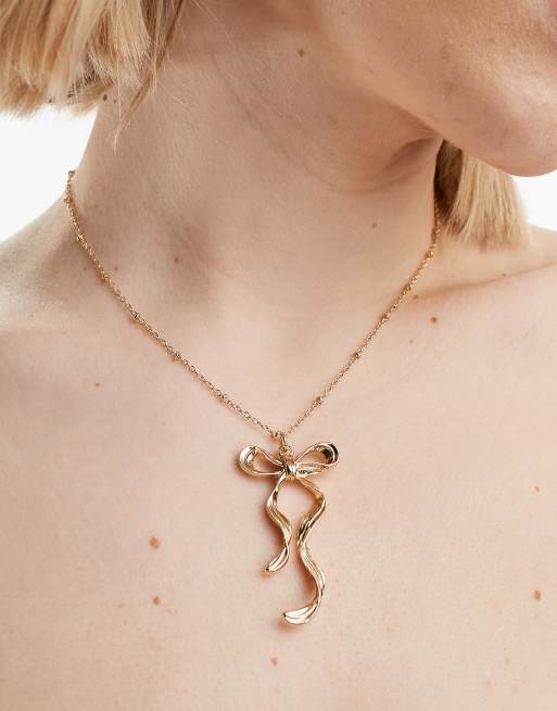 ASOS DESIGN – Naszyjnik z zawieszką w kształcie kokardki w kolorze złota