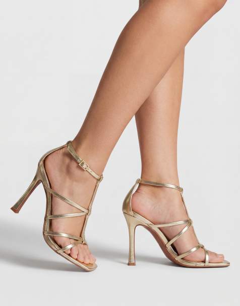 ASOS DESIGN – Natalia – Złote sandały na wysokim obcasie z paskami w kształcie litery T - view 1