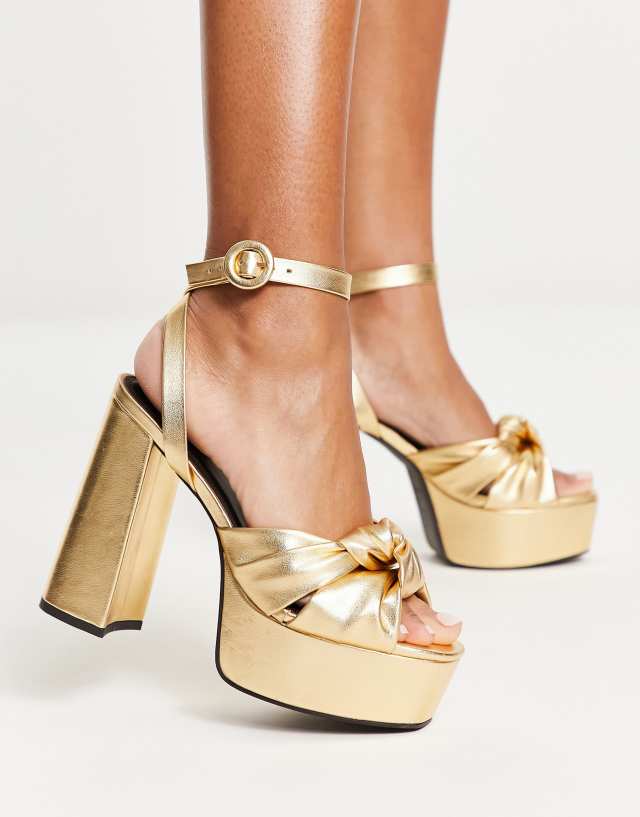 ASOS DESIGN Natia knotted platform heeled sandals in gold