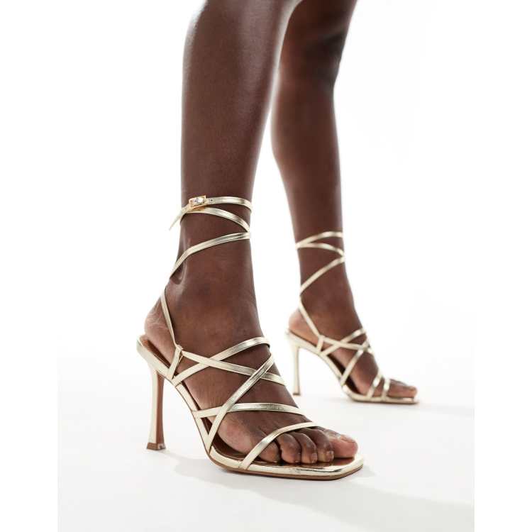 ASOS DESIGN Native strappy heeled sandals in gold