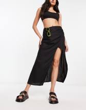 ASOS DESIGN midi skirt with ruched side and button detail in black