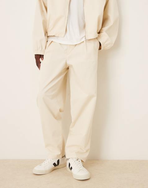 ASOS DESIGN – Naturvita, avsmalnande byxor i oversized fit med breda veckdetaljer, del av set - view 1