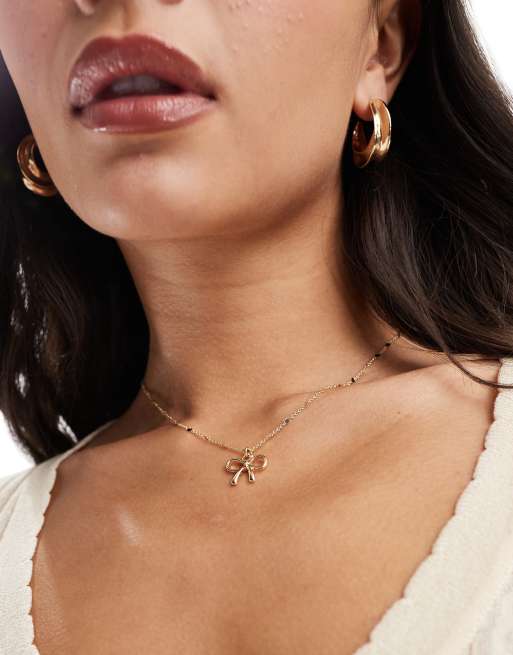  ASOS DESIGN necklace with bow pendant in gold tone