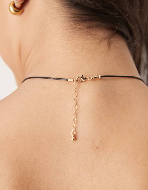 ASOS DESIGN necklace with cord and fish charms in gold tone