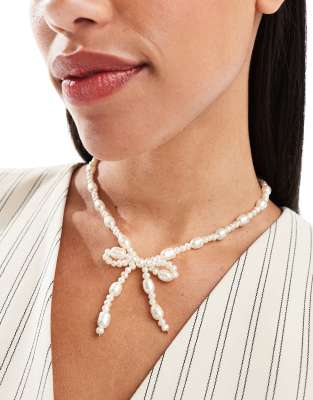 ASOS DESIGN necklace with faux freshwater pearl bow design-White