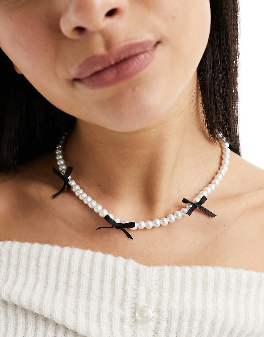 Asos Design Necklace With Faux Pearl And Black Bow Detail-white