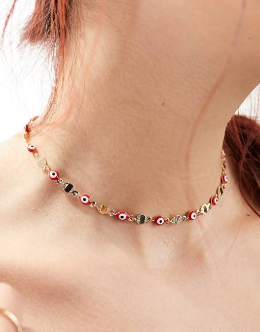 FhyzicsShops DESIGN necklace with red eye bead and hammered disk design in gold tone