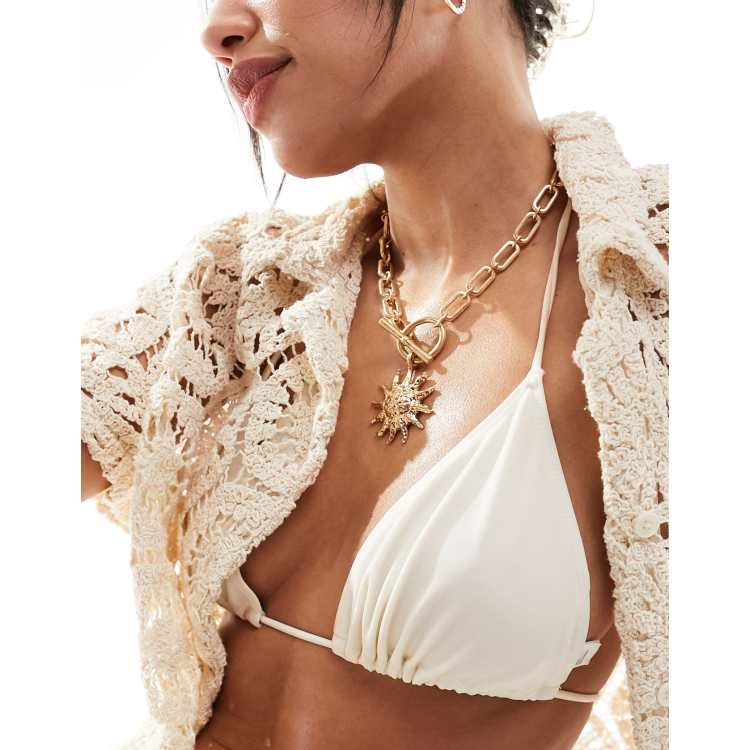 ASOS DESIGN body chain with triangle crystal breast plate in gold tone