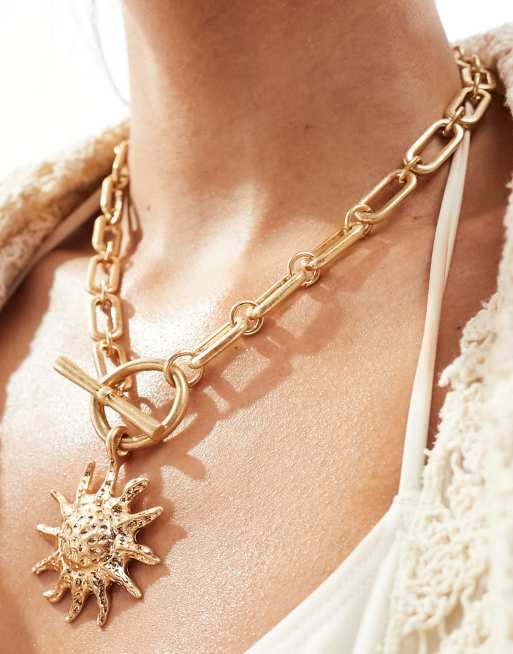 ASOS DESIGN body chain with triangle crystal breast plate in gold tone