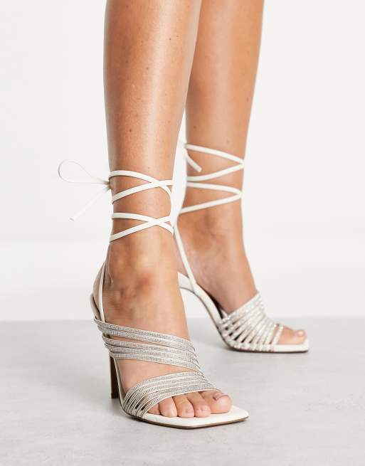 ASOS DESIGN Nest embellished strappy tie leg heeled sandals in off white