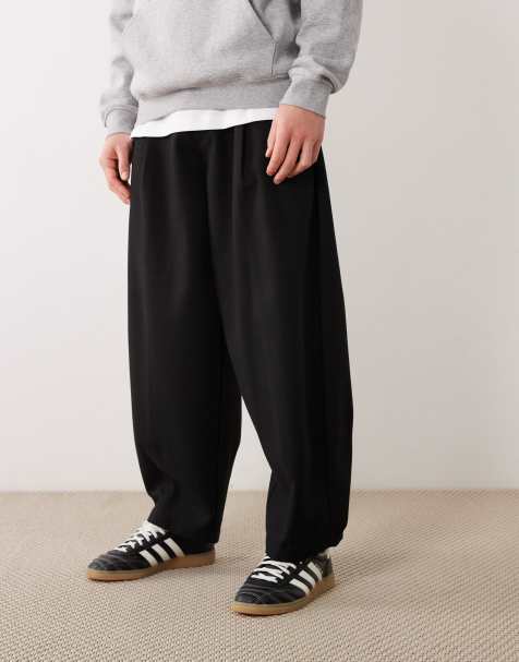 ASOS DESIGN - Nette geplooide broek van wolmix met wijde ballonpijpen en visgraatmotief in zwart - view 1