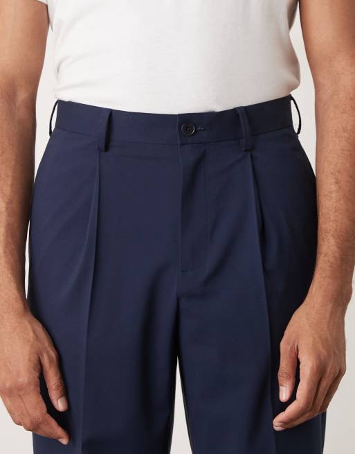 ASOS DESIGN - Nette geplooide ruimvallende toelopende broek in marineblauw, 4 van 5