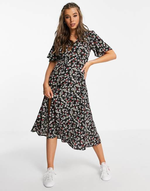 ASOS DESIGN - Nette midi jurk met knoopsluiting, gestrikte achterkant en uitlopende mouwen in zwarte bloemenprint