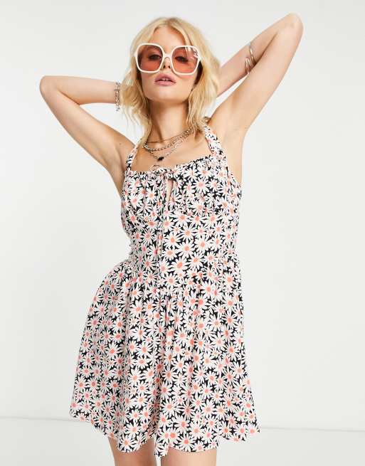 ASOS DESIGN - Nette mini-jurk met jaren 90-stijl, gestrikte buste en madeliefjesprint
