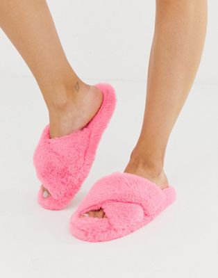 ASOS DESIGN Neve cross strap fluffy slider slippers in pink | ASOS