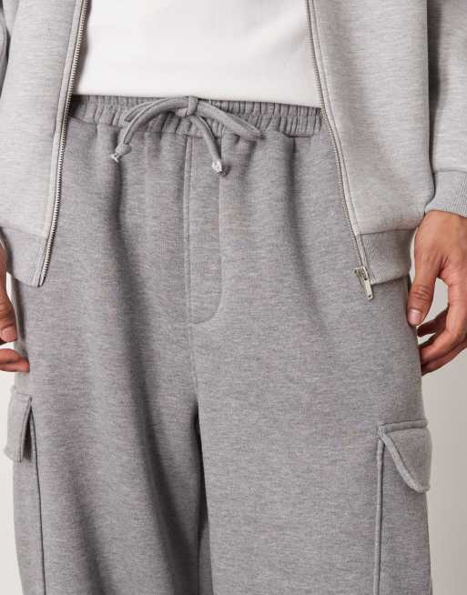 ASOS DESIGN New super baggy fit trackies with utility pockets in dark grey marl