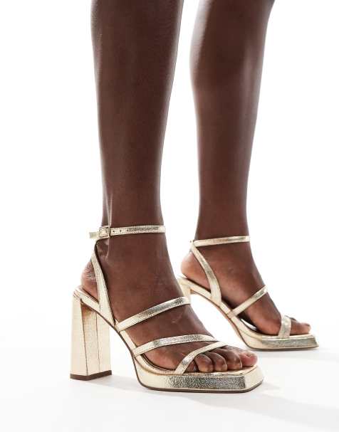 ASOS DESIGN Niagara strappy platform heeled sandals in gold - view 1