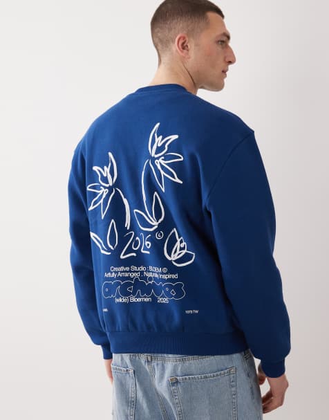 ASOS DESIGN – Niebieska bluza o luźnym kroju z okrągłym dekoltem i kwiatowym nadrukiem - view 1