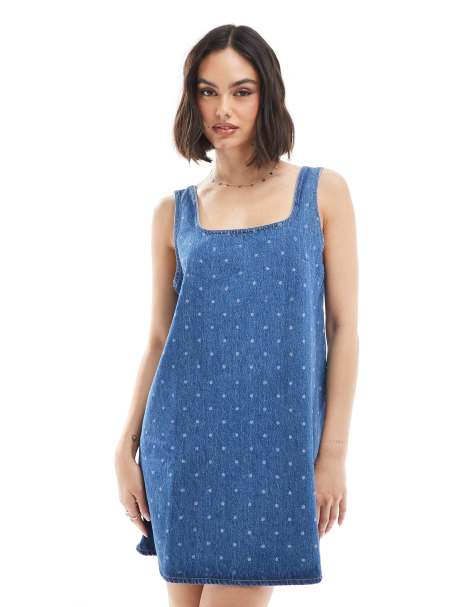 ASOS DESIGN denim mini dress with polka dot print in mid blue