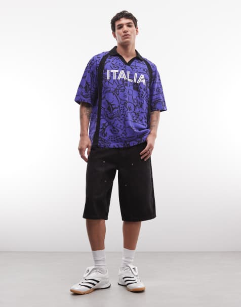 ASOS DESIGN – Niebieska koszulka polo o pudełkowym kroju oversize, ze wzorem na całej powierzchni i piłkarskim napisem graficznym „Italia" - view 1