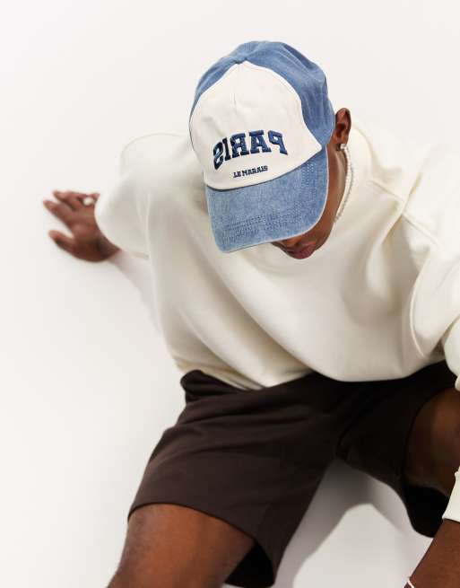 ASOS DESIGN – Niebieska miękka czapka baseballowa z daszkiem z wyhaftowanym napisem „Paris” i efektem sprania
