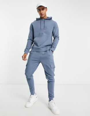 ASOS DESIGN – Niebieski dres z bluzą z kapturem i obcisłymi joggersami w stylu bojówek