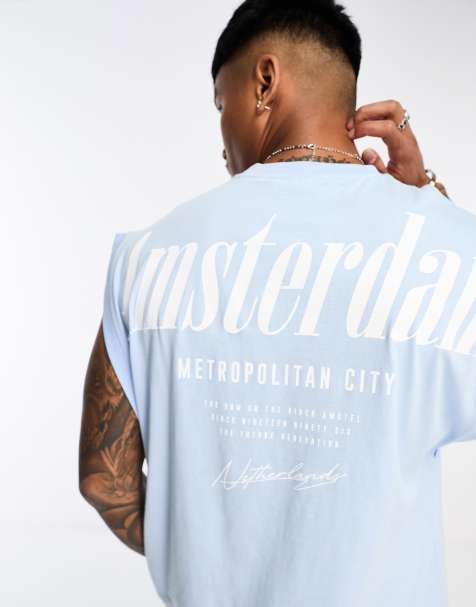 ASOS DESIGN – Niebieski podkoszulek oversize z nadrukiem Amsterdam na plecach - view 1