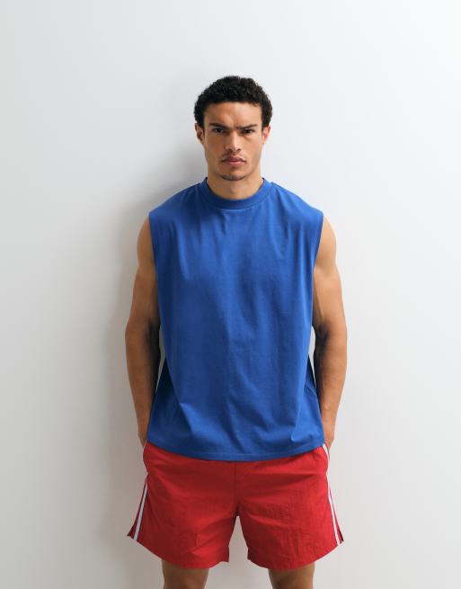 ASOS DESIGN – Niebieski top oversize bez rękawów z zaokrąglonym napisem, 2 z 7