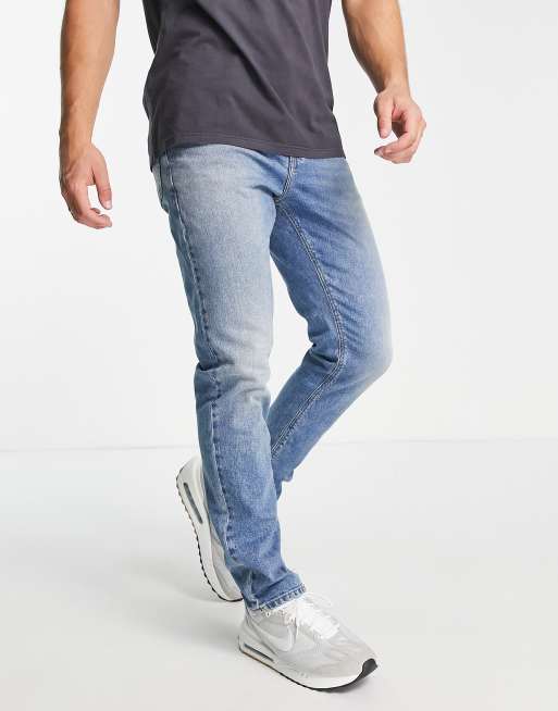 ASOS DESIGN – Niebieskie dopasowane jeansy ze stretchem i efektem sprania w stylu vintage 