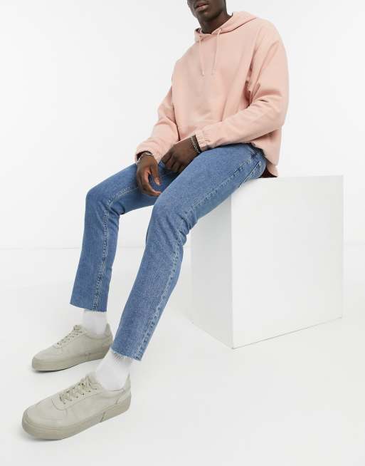 ASOS DESIGN – Niebieskie dopasowane jeansy ze stretchem i surowym wykończeniem